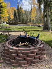 View of yard featuring an outdoor fire pit