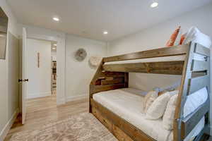 Bedroom with light hardwood / wood-style flooring