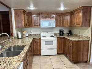 Kitchen featuring custom cabinets and granite counter tops