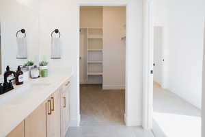 Bathroom with tile patterned floors and vanity