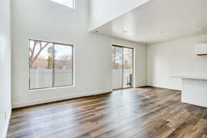 Unfurnished living room featuring hardwood / wood-style floors