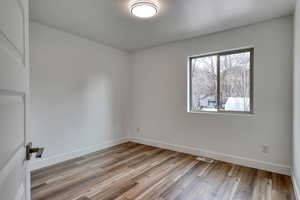 Spare room featuring light hardwood / wood-style flooring