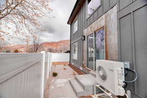 Exterior space with a mountain view and ac unit