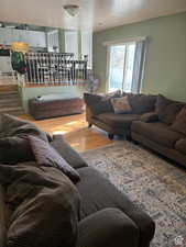 Living room featuring a textured ceiling and light wood-type flooring