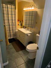 Bathroom featuring vanity and toilet