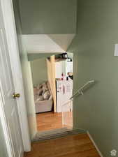 Hall featuring light hardwood / wood-style flooring