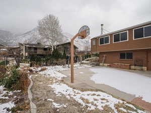 Exterior space featuring a mountain view and basketball court