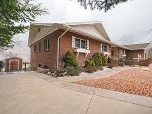 View of side of home with a mountain view