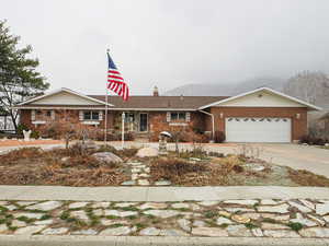 Ranch-style house featuring a garage