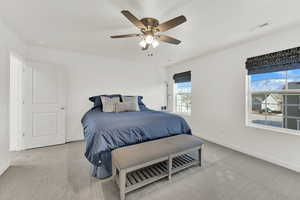 Bedroom with light carpet and ceiling fan