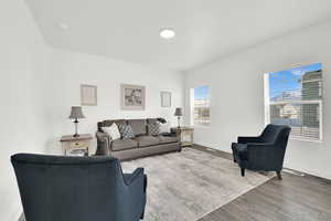 Living room with hardwood / wood-style floors