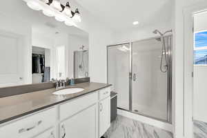 Bathroom with vanity and an enclosed shower