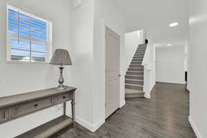 Corridor featuring dark hardwood / wood-style flooring