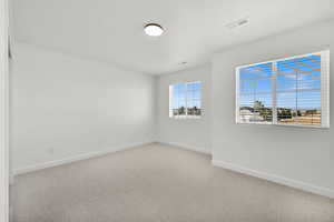 Unfurnished room featuring carpet floors