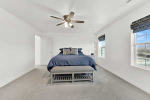 Bedroom featuring ceiling fan and light carpet