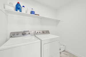 Laundry room with separate washer and dryer