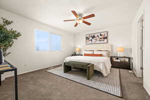 Bedroom with ceiling fan and dark carpet