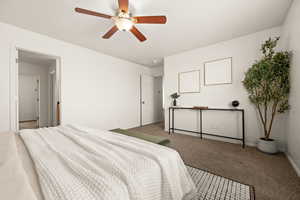 Bedroom with light colored carpet and ceiling fan