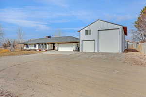 View of front of property with a garage and a porch