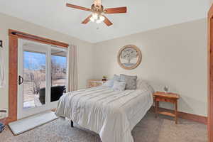 Bedroom with carpet and ceiling fan