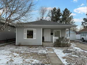 Bungalow-style house with an outbuilding and a garage