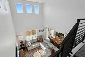 Living room featuring a towering ceiling