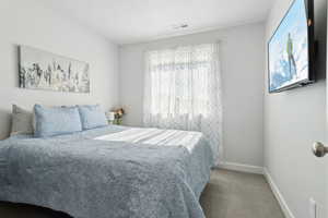 View of carpeted bedroom