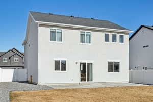 Rear view of house featuring a patio