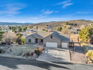 Single story home featuring a mountain view and a garage