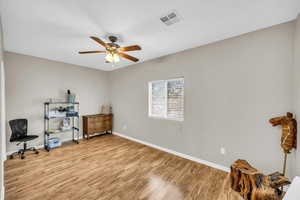 Office space featuring ceiling fan and light wood-type flooring