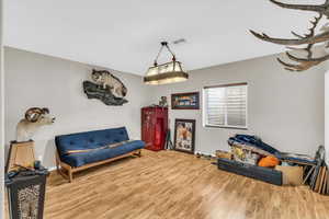 Sitting room featuring hardwood / wood-style flooring