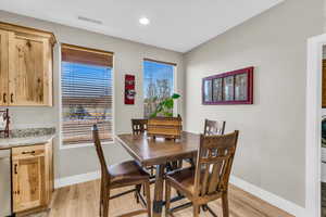 Dining area featuring light wood-type flooring