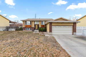 View of front of home featuring a garage