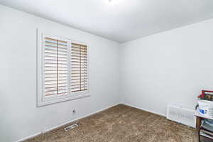 View of carpeted spare room