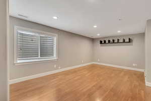 Spare room with light wood-type flooring