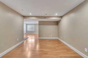 Unfurnished room with light wood-type flooring