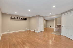 Basement featuring light hardwood / wood-style flooring