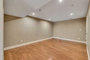 Unfurnished room with light hardwood / wood-style floors