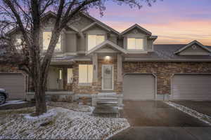 View of front of property featuring a garage