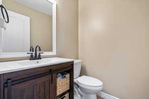 Bathroom featuring vanity and toilet