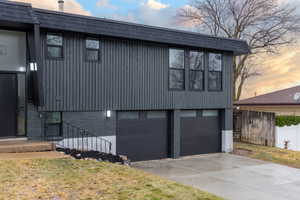 Property exterior at dusk with a garage