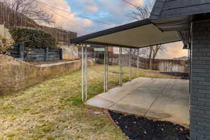 Yard at dusk with a patio