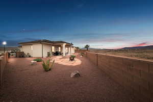 Yard at dusk with a patio