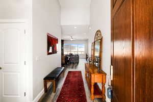 Corridor featuring dark hardwood / wood-style floors