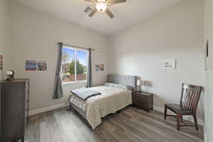 Bedroom featuring hardwood / wood-style floors and ceiling fan