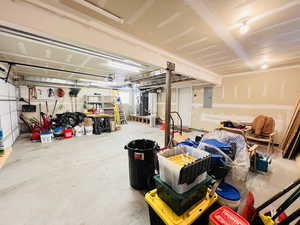 Garage with a garage door opener and electric panel
