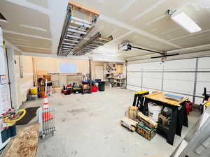 Garage featuring a garage door opener