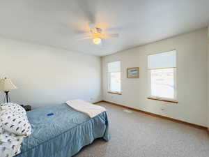 Bedroom with carpet floors and ceiling fan