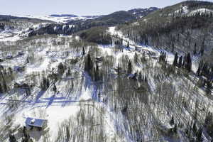 Snowy aerial view with a mountain view