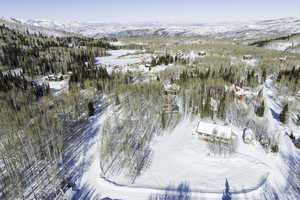 Snowy aerial view with a mountain view